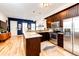 Modern kitchen with stainless steel appliances, granite countertops, and an open layout at 444 Inca St, Denver, CO 80204