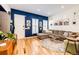 Cozy living room featuring stylish decor, hardwood floors, and plenty of natural light at 444 Inca St, Denver, CO 80204
