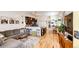 Open-concept living room and kitchen with hardwood floors, modern decor, and ample natural light at 444 Inca St, Denver, CO 80204