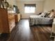 Well-decorated bedroom with wood floors and natural light at 21924 E Lake Ave, Aurora, CO 80015