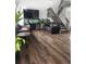 Bright living room boasts hardwood floors, a large TV, and fish tank, perfect for relaxing or entertaining at 21924 E Lake Ave, Aurora, CO 80015