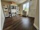 Spacious office features hardwood floors, ample storage, and large window with natural light at 21924 E Lake Ave, Aurora, CO 80015