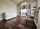 Well-lit office space with hardwood floors, built-in storage, and plenty of room for creativity at 21924 E Lake Ave, Aurora, CO 80015