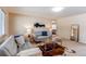 Comfortable living room with couches, modern decor, and natural light, creating a welcoming ambiance at 9880 W 76Th Pl, Arvada, CO 80005