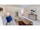 Bright living room featuring a modern couch, area rug, and decor at 9880 W 76Th Pl, Arvada, CO 80005