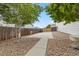 Large backyard featuring privacy fence, concrete patio and rock landscaping at 4545 Oxbow Dr, Brighton, CO 80601