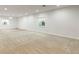 Spacious finished basement with recessed lighting, carpeted floors, and natural light at 4545 Oxbow Dr, Brighton, CO 80601