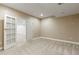 Basement bedroom with gray carpet, light-colored walls, recessed lights and an open doorway at 4545 Oxbow Dr, Brighton, CO 80601