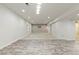 Finished basement with carpeted floor, recessed lighting, and window at 4545 Oxbow Dr, Brighton, CO 80601