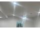 Bright, newly finished basement with recessed lighting and a view from the window at 4545 Oxbow Dr, Brighton, CO 80601