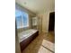 Beautiful bathroom with a soaking tub and a glass-enclosed shower at 4545 Oxbow Dr, Brighton, CO 80601