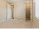 Neutral bedroom featuring carpeted floors and an adjacent closet with open door at 4545 Oxbow Dr, Brighton, CO 80601