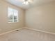 Neutral bedroom featuring carpeted floors and a window with blinds for soft, natural light at 4545 Oxbow Dr, Brighton, CO 80601