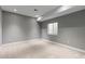 Bedroom featuring neutral walls, carpeted floors, and a window with blinds for natural light at 4545 Oxbow Dr, Brighton, CO 80601