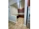 Convenient butlers pantry area with matching cabinets and granite countertops at 4545 Oxbow Dr, Brighton, CO 80601