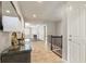 Inviting entryway with tile flooring, modern decor, and views into the bright living spaces at 4545 Oxbow Dr, Brighton, CO 80601