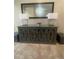 Elegant entryway showcasing a sleek console table with lamps and a large decorative mirror at 4545 Oxbow Dr, Brighton, CO 80601