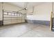 Spacious two-car garage with concrete floor and garage door at 4545 Oxbow Dr, Brighton, CO 80601