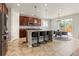 Spacious kitchen featuring an island with barstool seating and stainless steel appliances at 4545 Oxbow Dr, Brighton, CO 80601