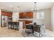 A kitchen that features an island with barstool seating, stainless steel appliances, and a breakfast nook at 4545 Oxbow Dr, Brighton, CO 80601