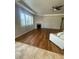 Spacious living room featuring hardwood floors, a cozy fireplace, and plenty of natural light at 4545 Oxbow Dr, Brighton, CO 80601