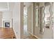 Open-concept living space with fireplace, abundant natural light, and stylish design at 4545 Oxbow Dr, Brighton, CO 80601