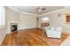 Inviting living room with a cozy fireplace, hardwood floors, and comfortable seating at 4545 Oxbow Dr, Brighton, CO 80601
