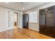 Office space with hardwood floors, built-in cabinetry, natural light, and french doors to bath at 4545 Oxbow Dr, Brighton, CO 80601