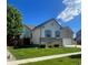 Well maintained home featuring a tidy lawn, mature landscaping, and a brick foundation at 4545 Oxbow Dr, Brighton, CO 80601