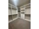 Spacious walk-in closet with custom shelving and hanging rods at 4545 Oxbow Dr, Brighton, CO 80601