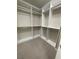 Well-organized walk-in closet with ample storage space and shelving at 4545 Oxbow Dr, Brighton, CO 80601