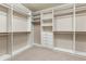 Well-organized walk-in closet with custom shelving and ample storage space at 4545 Oxbow Dr, Brighton, CO 80601