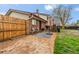 Back yard featuring brick patio, outdoor seating area, and grass at 12603 E Ohio Ave, Aurora, CO 80012