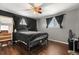 Bedroom featuring wood floors, ceiling fan, and natural light from windows at 12603 E Ohio Ave, Aurora, CO 80012