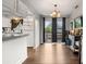 Dining area with white cabinets, wood floors, chandelier, and sliding glass doors at 12603 E Ohio Ave, Aurora, CO 80012