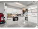 Bright kitchen with granite countertops, wood floors, and stainless steel appliances at 12603 E Ohio Ave, Aurora, CO 80012