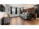 Cozy living room features wood floors, lots of natural light, and stylish decor at 12603 E Ohio Ave, Aurora, CO 80012