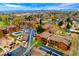 Aerial view of the property showcasing the well-maintained community with mature trees and swimming pool at 7080 W 20Th Ave # 202, Lakewood, CO 80214