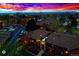 Aerial evening view of property showcasing complex with a twilight backdrop at 7080 W 20Th Ave # 202, Lakewood, CO 80214