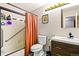 Well-maintained bathroom featuring a shower-tub combo and modern vanity at 7080 W 20Th Ave # 202, Lakewood, CO 80214