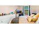 Comfortable bedroom featuring large windows, ample natural light, and closet space at 7080 W 20Th Ave # 202, Lakewood, CO 80214