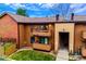 Attractive townhome featuring private balconies, neat lawn, and direct stair access to the entrance at 7080 W 20Th Ave # 202, Lakewood, CO 80214