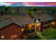 Aerial evening view of two-story complex highlighting the balconies and updated roofs at 7080 W 20Th Ave # 202, Lakewood, CO 80214