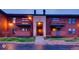 Exterior view of a townhome with front-facing balconies, landscaped lawn, and sidewalk access at 7080 W 20Th Ave # 202, Lakewood, CO 80214