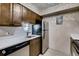 Modern kitchen featuring a stainless steel refrigerator, updated cabinets, and modern fixtures at 7080 W 20Th Ave # 202, Lakewood, CO 80214