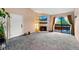 Living room with stone fireplace, plush carpeting, and sliding door at 7080 W 20Th Ave # 202, Lakewood, CO 80214