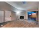 Spacious living room with a stone fireplace, plush carpeting, and sliding glass doors to balcony at 7080 W 20Th Ave # 202, Lakewood, CO 80214