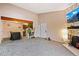 Open concept living room with stone fireplace and adjoined kitchen at 7080 W 20Th Ave # 202, Lakewood, CO 80214