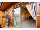 Inviting outdoor patio area, featuring a sliding glass door with outdoor string lights, perfect for relaxation at 7080 W 20Th Ave # 202, Lakewood, CO 80214