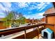 Balcony view of the apartment complex, showcasing trees and community parking at 7080 W 20Th Ave # 202, Lakewood, CO 80214